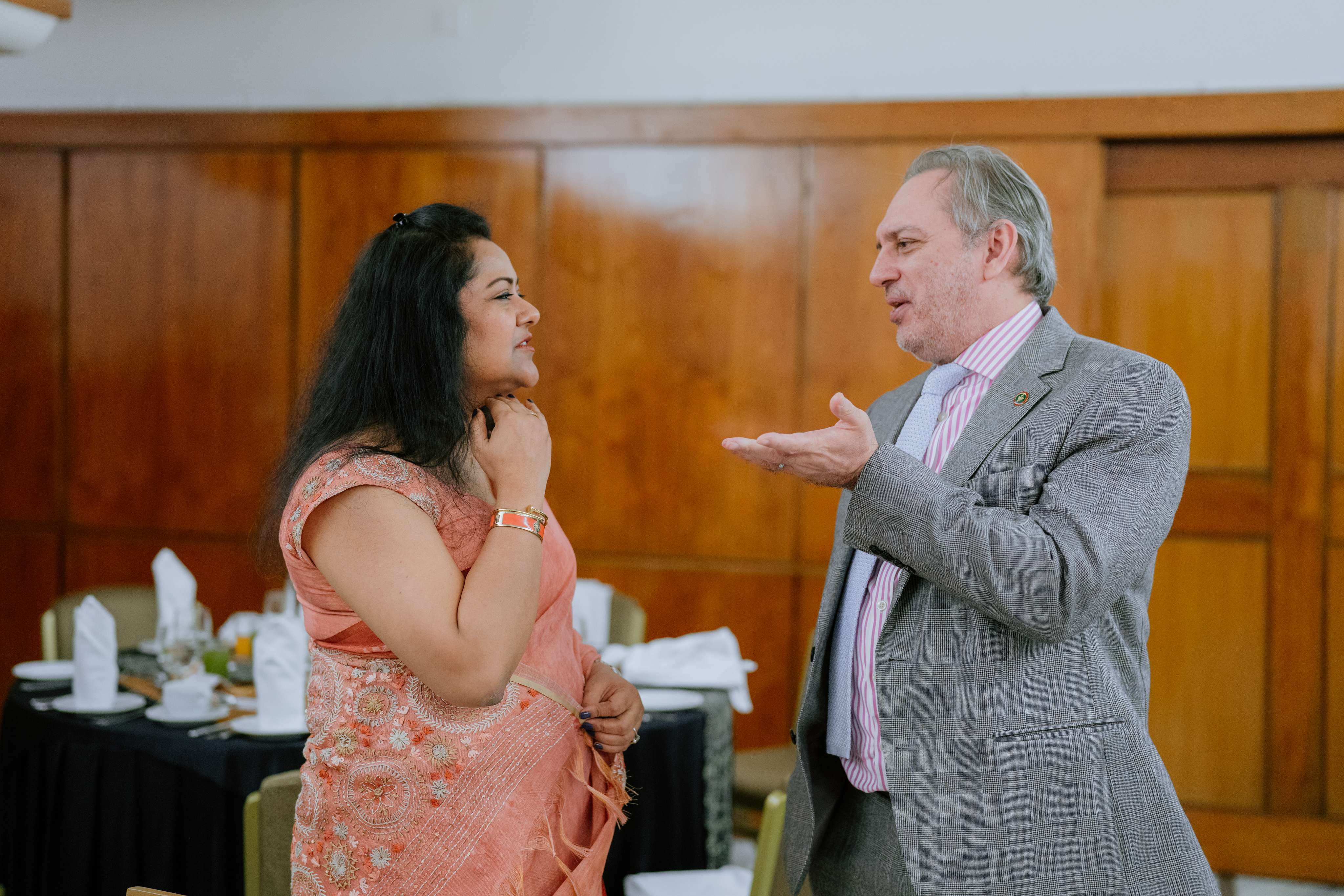 Members exchanging greetings at the Iftar